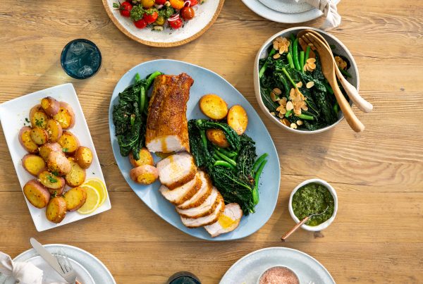 Herb and Garlic Pork Loin with Roasted Potatoes, Kale Salad, and Tomatoes